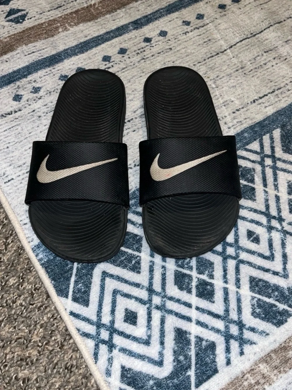 Nike Kids Black Slide Sandals with White Swoosh Accent